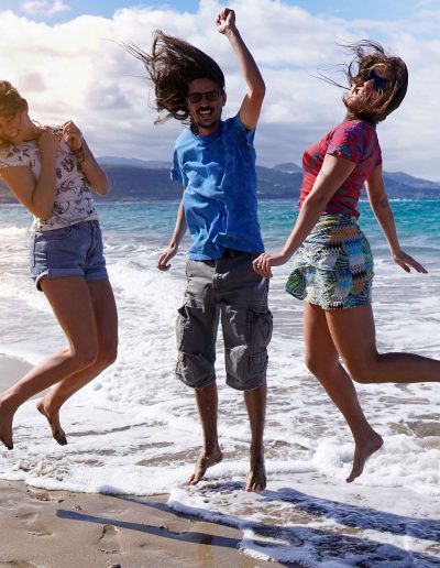 happy-peole-jumping-in-the-beach